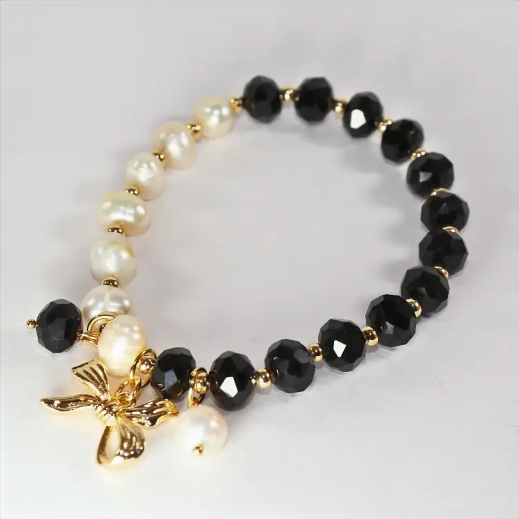 Pulsera de cristales negros y perlas de rio